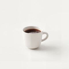 Simple white coffee cup with black coffee, minimalist style