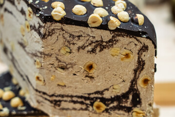 Halva is a traditional Middle Eastern confection made primarily from sesame paste and sugar. Cake with rich, sweet flavor and crumbly texture. Halva cake. Halva dessert and a snack.