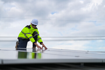 Men technicians mounting photovoltaic solar moduls on roof of house.