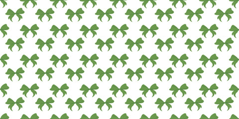 Seamless pattern of green bows on a white background.