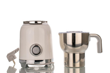 One milk frother, close-up, isolated on white background.