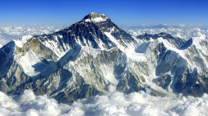 Naklejka premium Majestic Everest: A breathtaking aerial view of the Himalayas' highest peak, showcasing its snow-capped grandeur and imposing scale above the clouds.