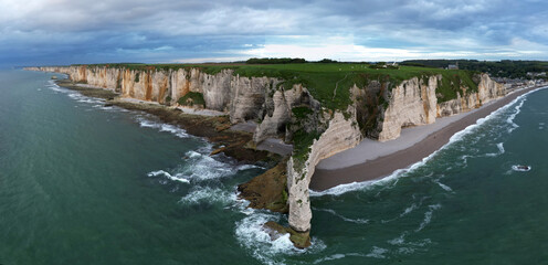 Aerial view of the famous white limestone cliffs near Etretat during sunset, France