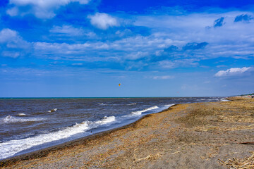 Panoramic photos on a windy day with rough sea of ​​the beach of Marina di Castagneto Carducci Tuscany Italy