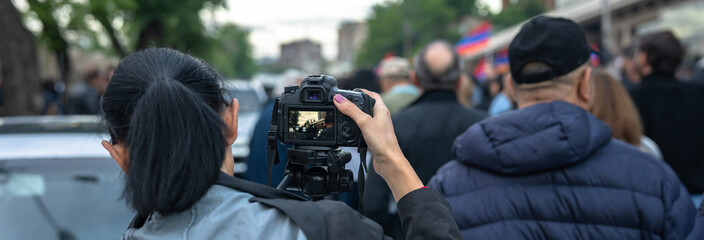 Loudspeakers on camera during a protest in the city, political unrest
