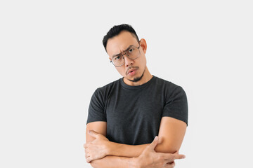 Obraz premium Serious angry face Asian freelance man bun hair in black on white.