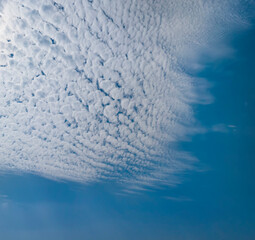 blue sky background with tiny clouds