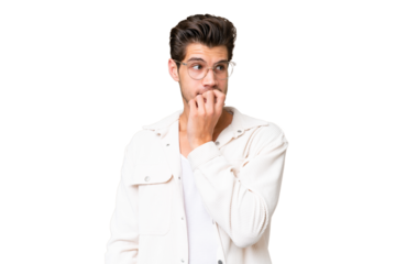 Young handsome caucasian man over isolated background nervous and scared