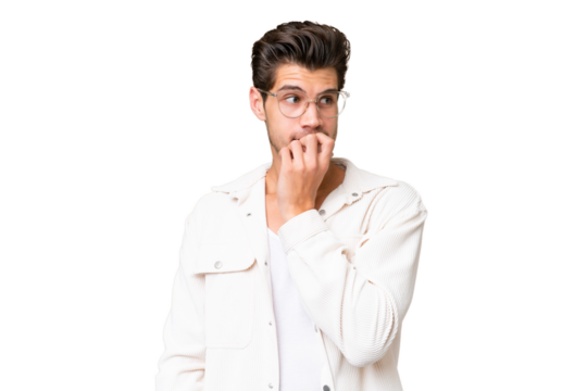 Young handsome caucasian man over isolated background nervous and scared