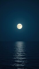 Obraz premium The moon rising over a calm sea on a peaceful night, ocean, clouds, sky