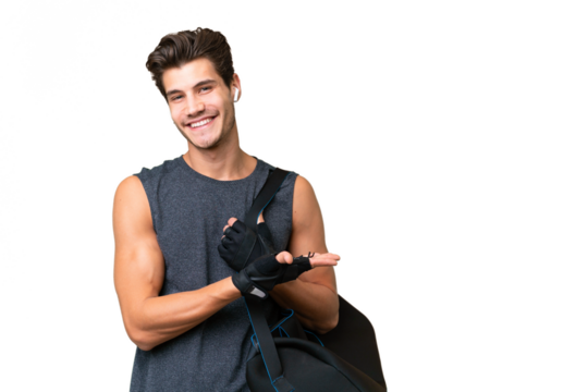 Young sport caucasian man with sport bag over over isolated background presenting an idea while looking smiling towards