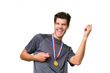 Young caucasian man with medals over isolated background making guitar gesture