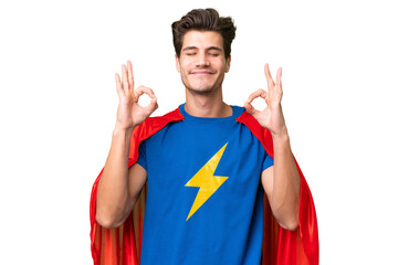 Super Hero caucasian man over isolated background in zen pose