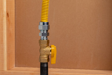 Natural gas or propane shutoff valve. Plumbing, home maintenance, repair and remodeling concept.