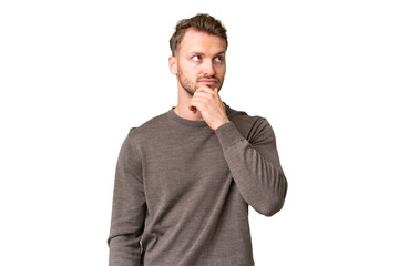 Young handsome caucasian man over isolated chroma key background having doubts