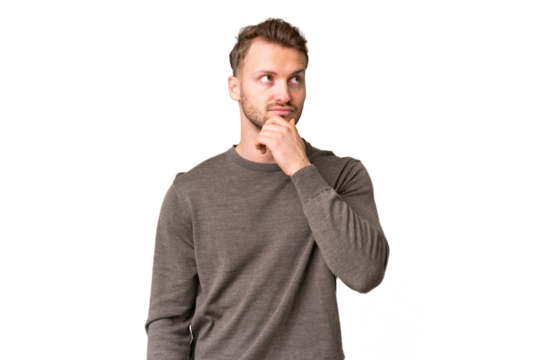 Young handsome caucasian man over isolated chroma key background having doubts