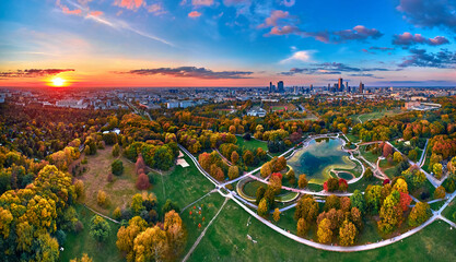 A beautiful panoramic aerial drone view of the sunset at Pola Mokotowskie in Warsaw, Poland - "Mokotow Field" is a large park in Warsaw - Is called "Jozef Pilsudski Park" or "Warsaw Central Park"