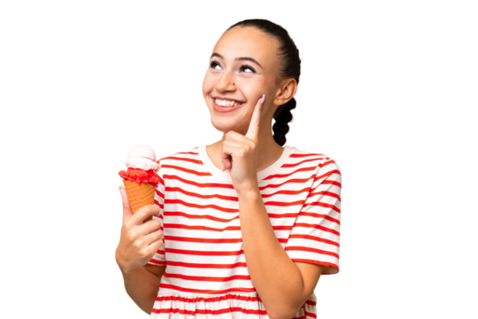 Young Arab woman with a cornet ice cream over isolated background thinking an idea while looking up
