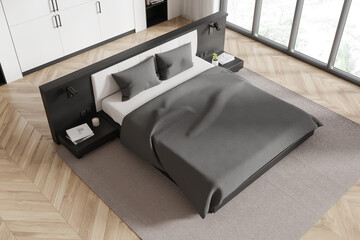 Modern bedroom interior with minimalist bed, cozy gray bedding, and stylish wooden flooring. 3D Rendering