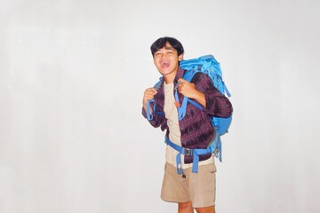 Handsome Asian man wearing blue gravel bag, hiking or vacationing very helpful on isolated white background