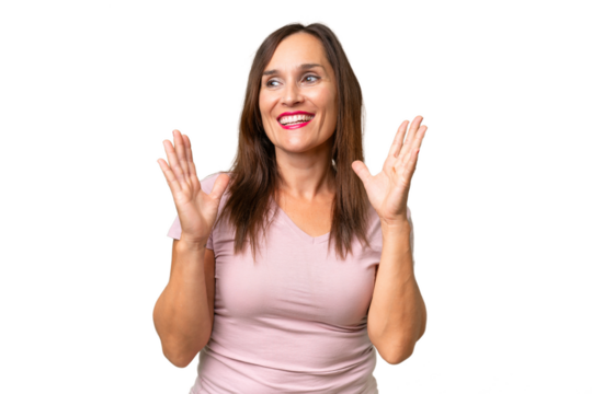 Middle-aged caucasian woman over isolated background with surprise facial expression