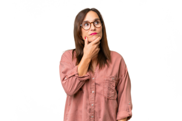 Middle-aged caucasian woman over isolated background having doubts