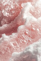 Fototapeta premium Soft pink foam with bubbles on a textured surface in a calm setting