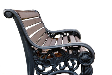 There is a black and brown bench with a black top on a white background on the sidewalk