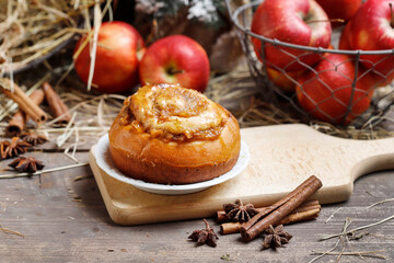 Sweet bun with cinnamon and apple.