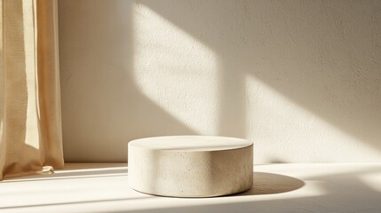Minimalist Beige Cylinder Display on Window Sill in Sunlight