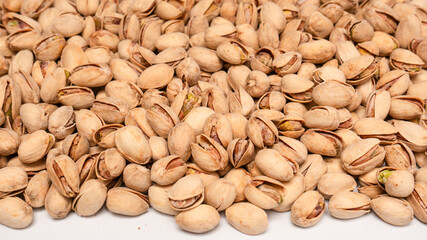 Tasty pistachios isolated on a white background.