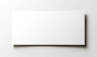 Fototapeta premium blank white paper sheet is displayed horizontally on light background, offering clean and minimalistic look perfect for various creative projects