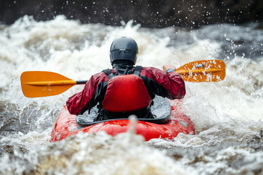Kayaker navigating treacherous whitewater rapids, the raft bouncing wildly on the waves, adrenaline as they battle to stay in control.