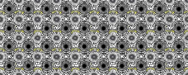 Geometric pattern of gray and yellow circular elements, creating a repeating textured surface.