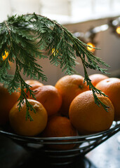 christmas tree with oranges and tangerines. 