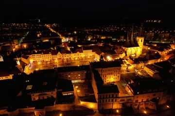 Night aerial view of Louny town during Christmas, illuminated with festive lights and decorations, creating a magical holiday atmosphere in Bohemia