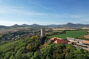 Fototapeta premium Aerial panorama of Skalka Castle in Vlastislav Bohemia showcasing its historical significance and scenic surroundings in the Czech countryside, a blend of culture and nature.