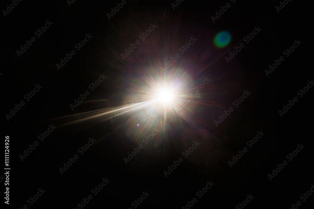 Fototapete Easy to add lens flare effects for overlay designs or screen blending mode to make high-quality images. Abstract sun burst, digital flare, iridescent glare over black background.