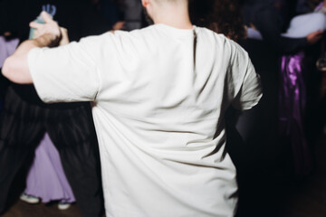 Couples dancing traditional latin argentinian dance milonga in the ballroom, tango salsa bachata...