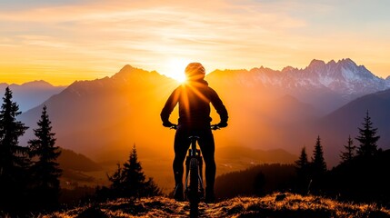 Fototapeta premium Silhouette of a cyclist at sunset, overlooking a majestic mountain range. The warm golden light bathes the scene in a tranquil, adventurous mood.