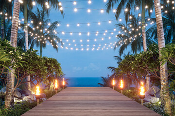 Wooden balcony at dusk surrounded by lush tropical plants with sea view background 3d render. Decorated with string lights and torches