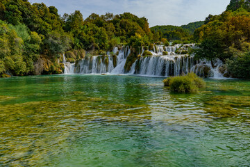 Beautiful view of the waterfalls covered in a dense forest