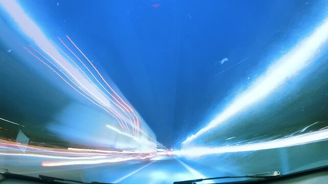 Speeding through the night with vibrant lights illuminating the road ahead in a thrilling drive adventure on M1, UK