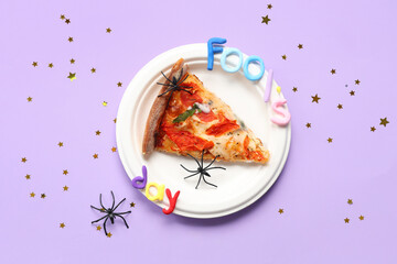 Table setting with piece of spoiled pizza, fake spiders and text FOOL'S DAY on lilac background