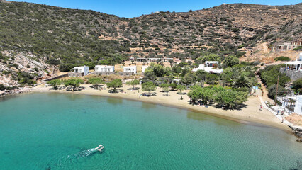 Obraz premium Aerial drone photo of small paradise beach of Vlycho next to famous and picturesque seaside fishing village of Faros, Sifnos island, Cyclades, Greece