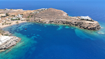 Aerial drone photo of small beach of Fasolou next to famous and picturesque seaside fishing village of Faros, Sifnos island, Cyclades, Greece