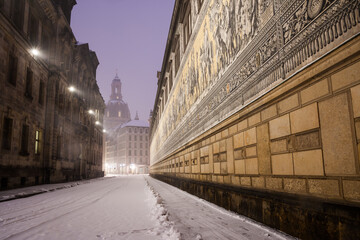 Fuerstenzug in Dresden with the church of our lady in the background in winter