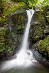 Long exposure of a waterfall on the Hoar Oak Water river at Watersmeet in Exmoor National Park