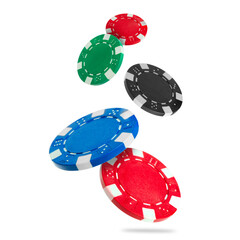 Different casino chips falling on white background