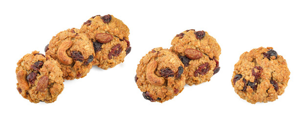 Tasty cookies with nuts and dried cranberries isolated on white